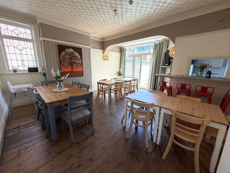 A dining room with multiple tables and chairs at Avalon Lodge in Bridlington