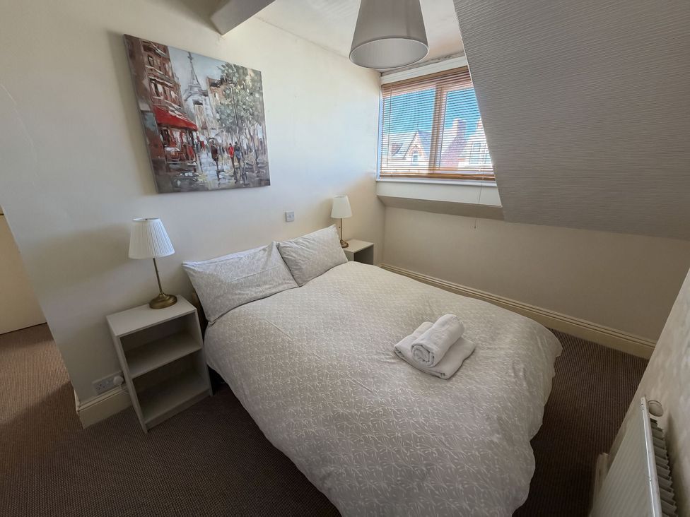 A bedroom with a bed and lamp at Avalon Lodge in Bridlington