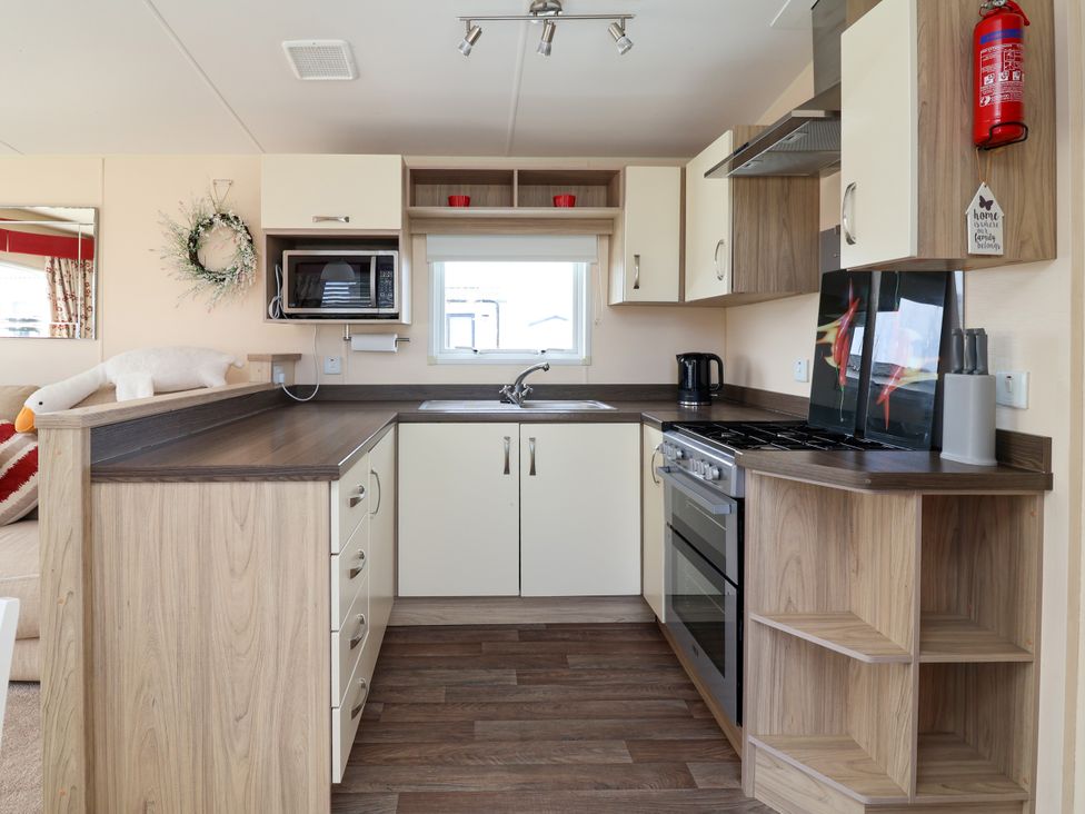 A kitchen with sink and oven at 15 Elm Crescent in Rhyl