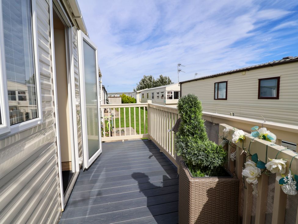 A balcony with a planter and railing at 15 Elm Crescent in Rhyl