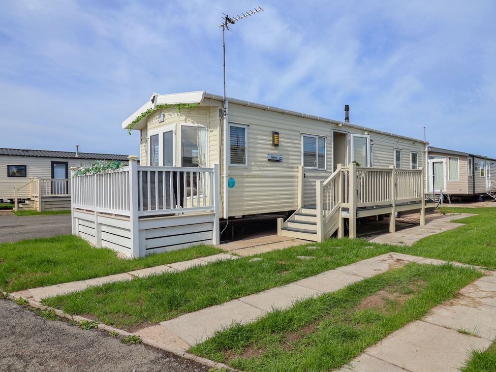 A mobile home with a deck and steps at 15 Elm Crescent Rhyl