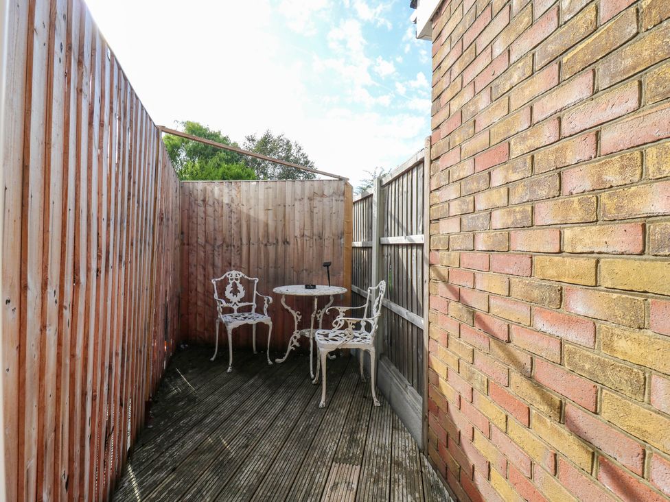 An outdoor space with a table and chairs at Annex in Southend-On-Sea