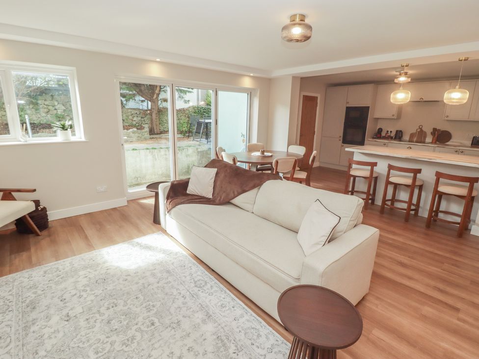 A living room with a sofa and coffee table at Flat 1 in Tenby