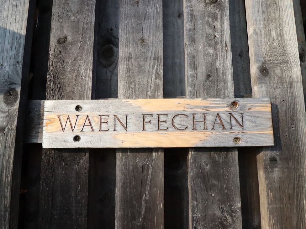 A wooden sign displaying the name Waen Fechan