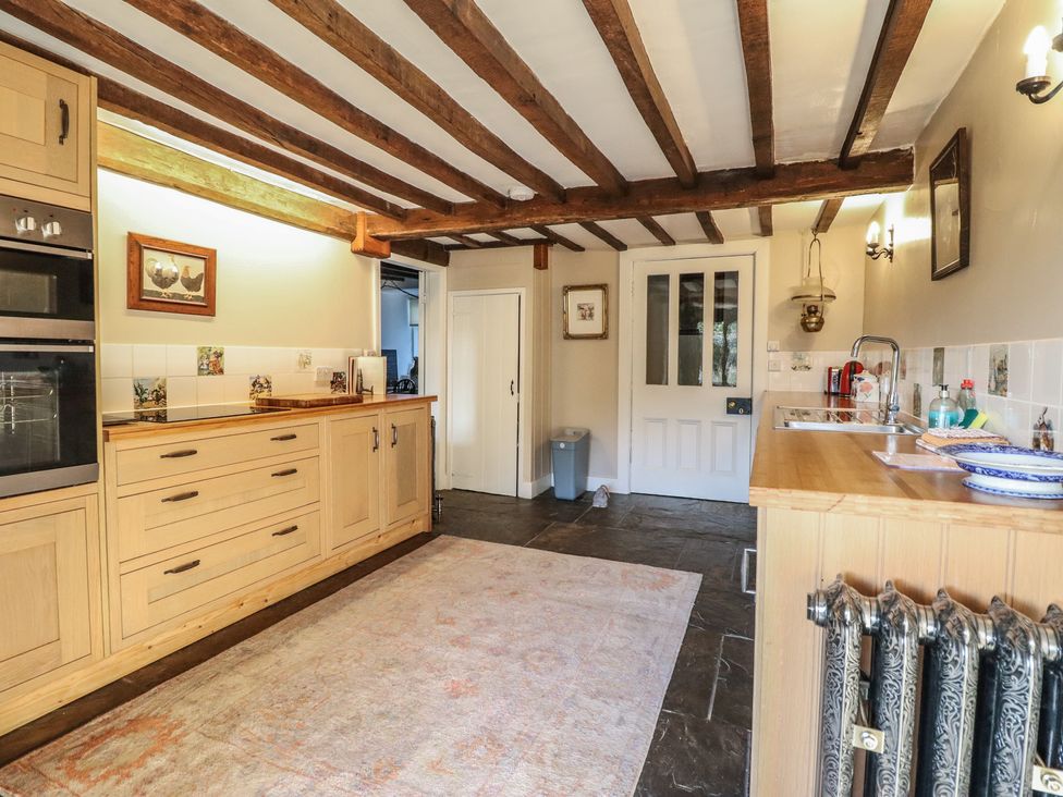 A kitchen with cabinets and appliances at Waen Fechan in Dolgellau