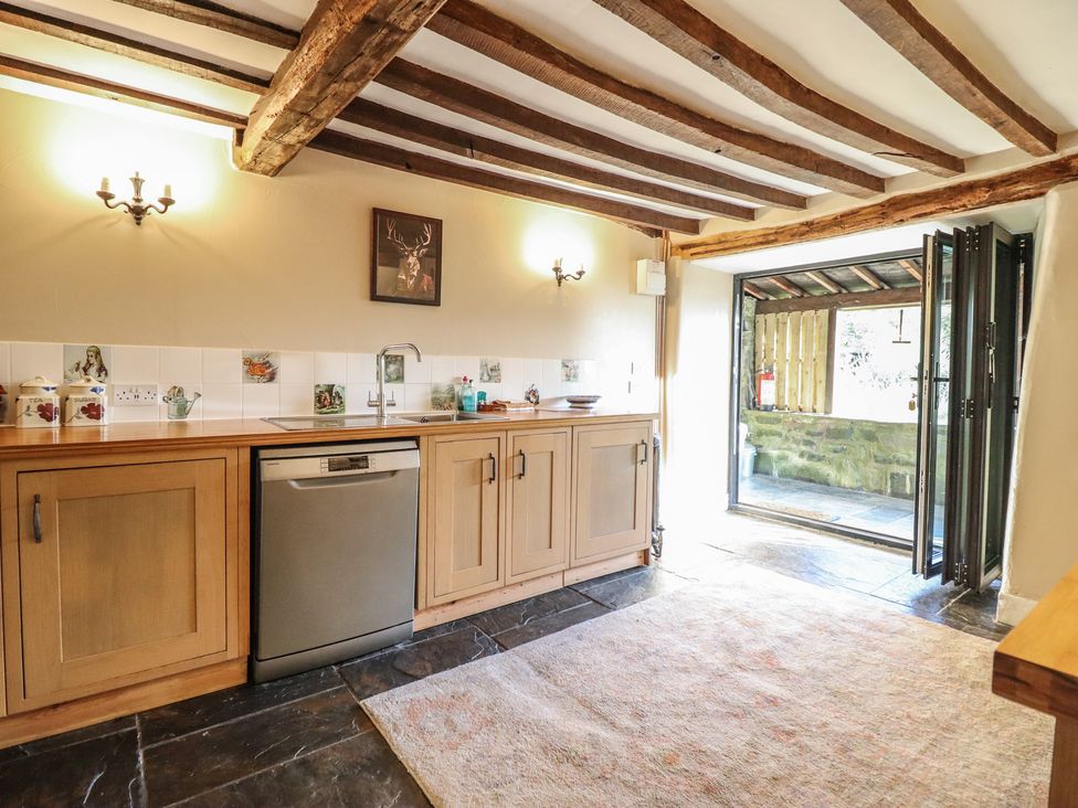A kitchen with a sink and dishwasher at Waen Fechan in Dolgellau