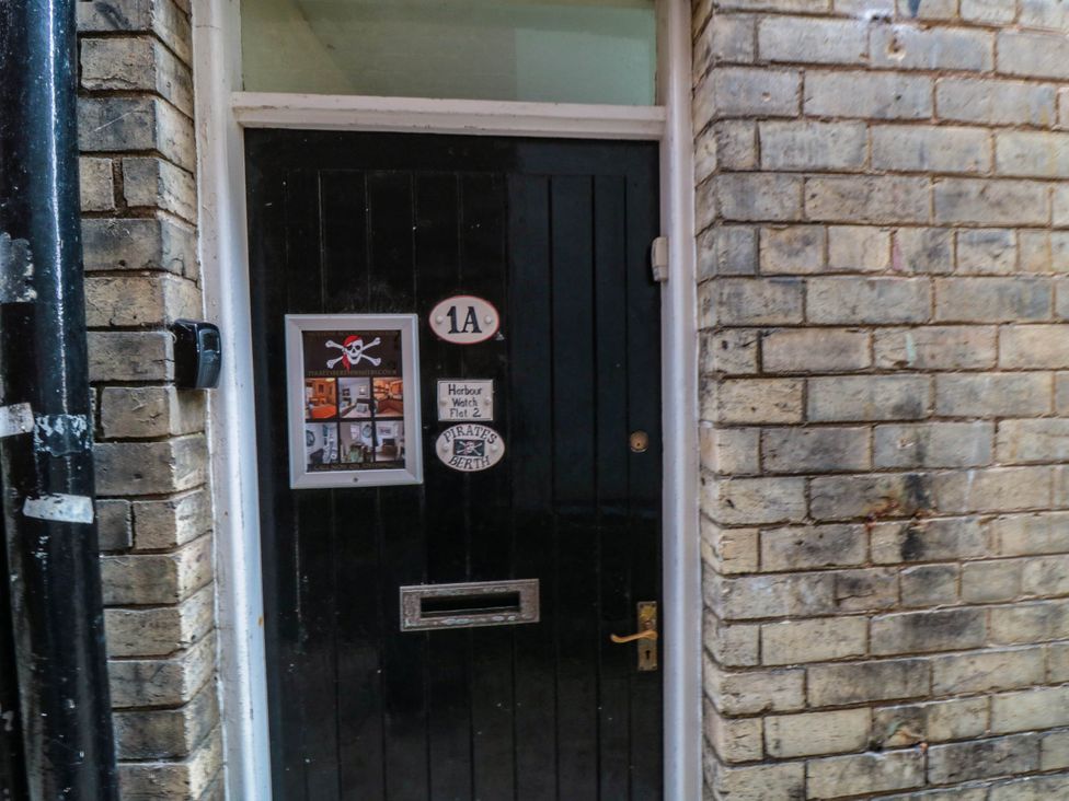 A door with mail slot and nameplate at 1 St. Anns Lane in Whitby
