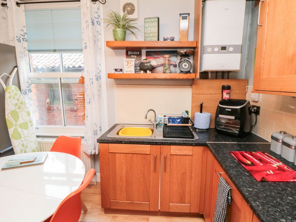 A kitchen with sink and appliances at 1 St. Anns Lane Whitby