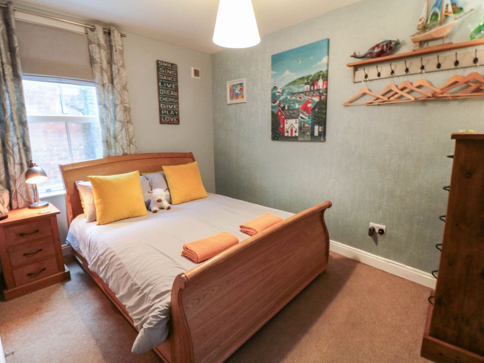 A bedroom with a bed and bedside lamp at 1 St. Anns Lane in Whitby