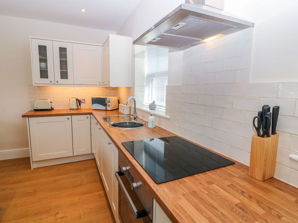 A kitchen with cabinetry and appliances at The Croft in Ashbourne