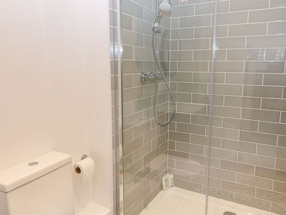 A bathroom with a shower and toilet at The Croft in Ashbourne