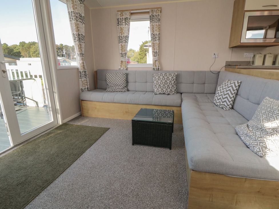 A living room with a sofa and coffee table at 10 Gosling in Scarborough