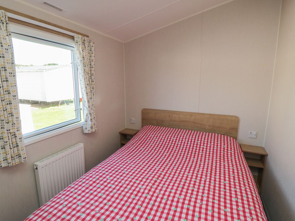 A bedroom with a bed and a window at 10 Gosling in Scarborough