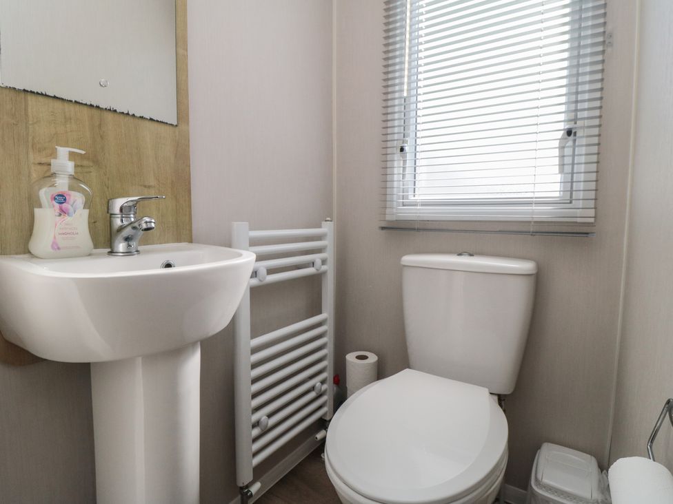 A bathroom with a sink and toilet at 10 Gosling in Scarborough