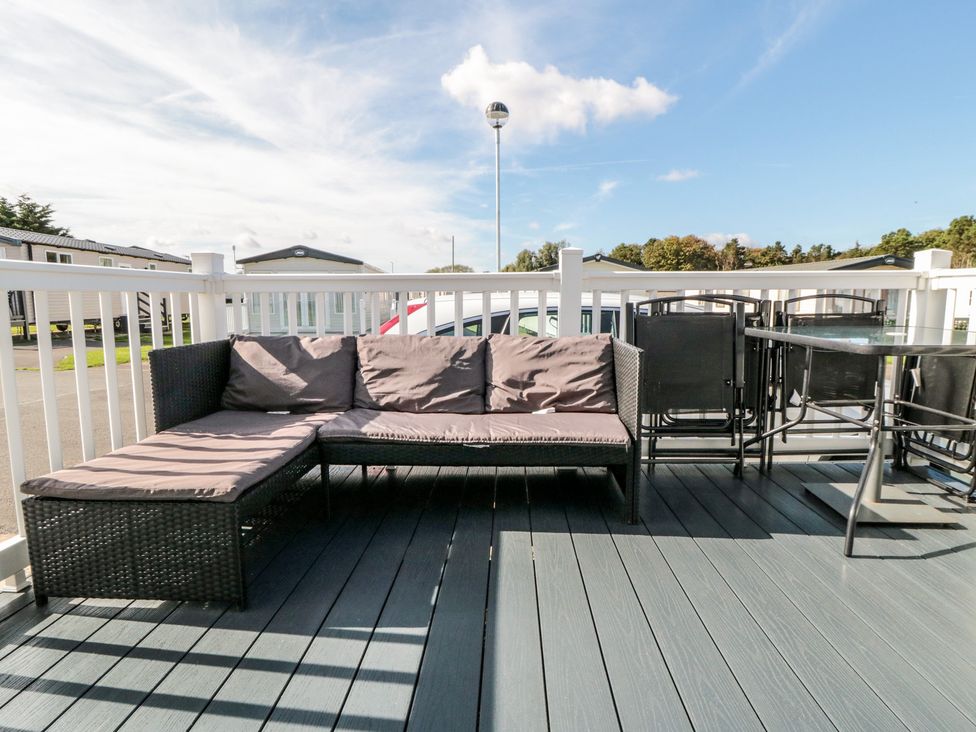 An outdoor seating area with a couch and table at 10 Gosling in Scarborough