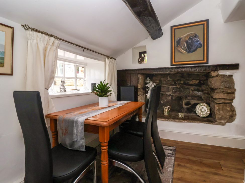 A dining room with a table and chairs at Brownhill Bungalow in West Morton near Riddlesden