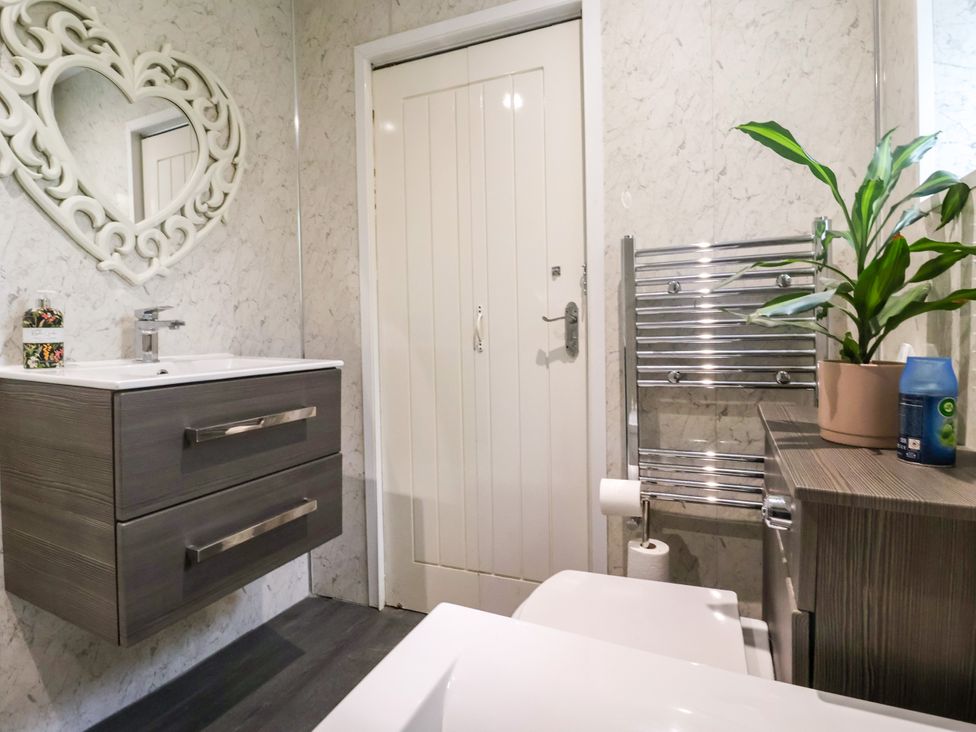 A bathroom with a sink and toilet at Brownhill Bungalow in West Morton near Riddlesden