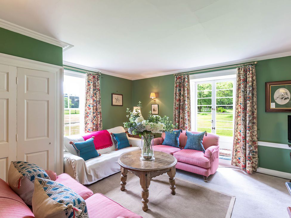 A living room with sofas and a coffee table at Wardhill Castle near Inverurie