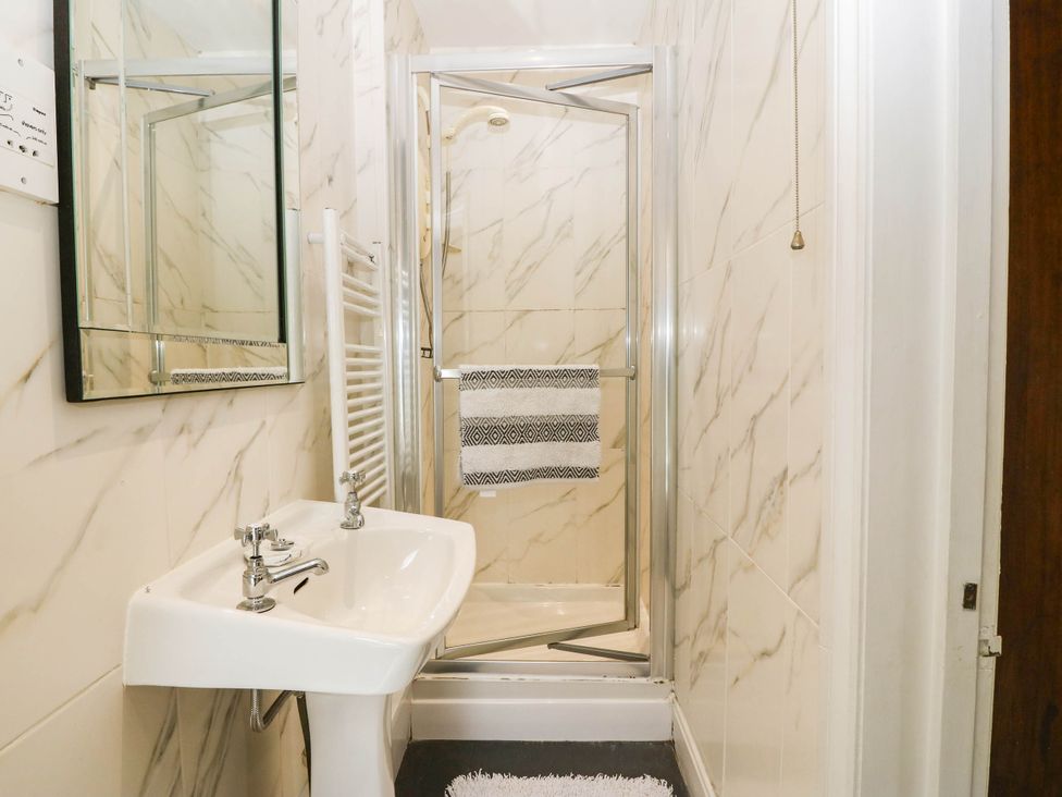 A bathroom with a sink and shower at Meifod Country House, Caernarfon