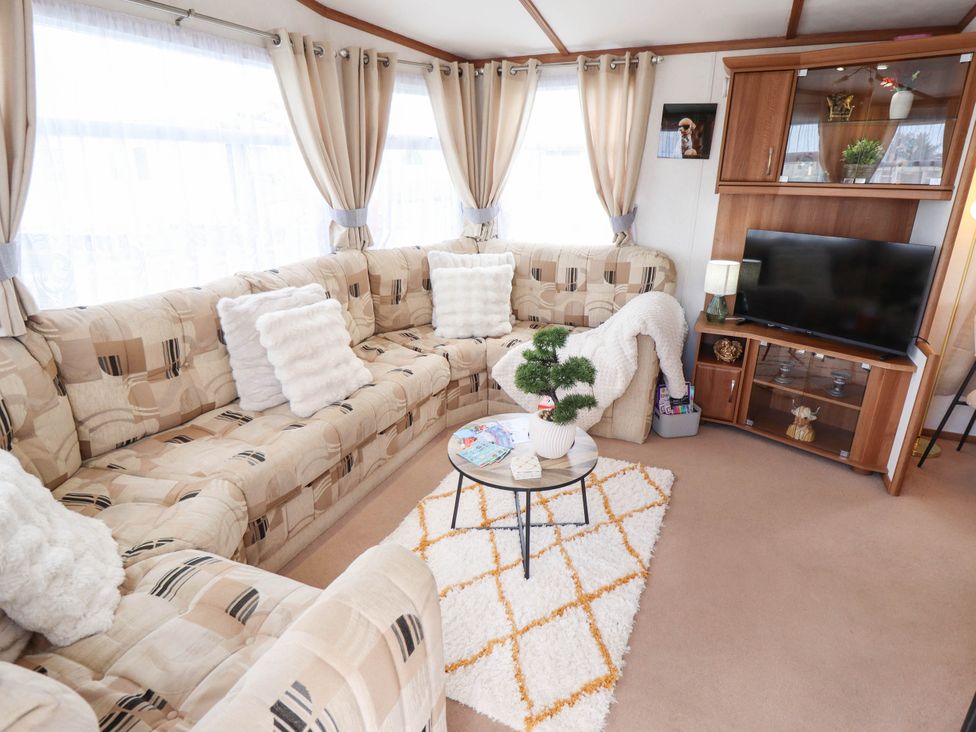 A living room with a sofa and coffee table at Atlas in Ingoldmells