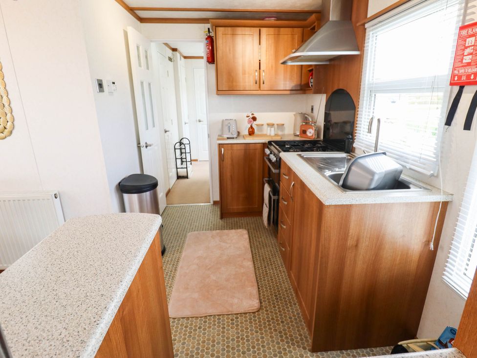 A kitchen with a sink and stove at Atlas in Ingoldmells