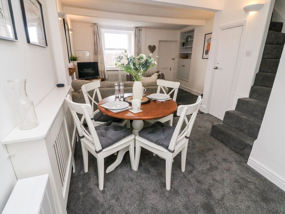 A dining area with a table and chairs at Crag Cottage in Settle