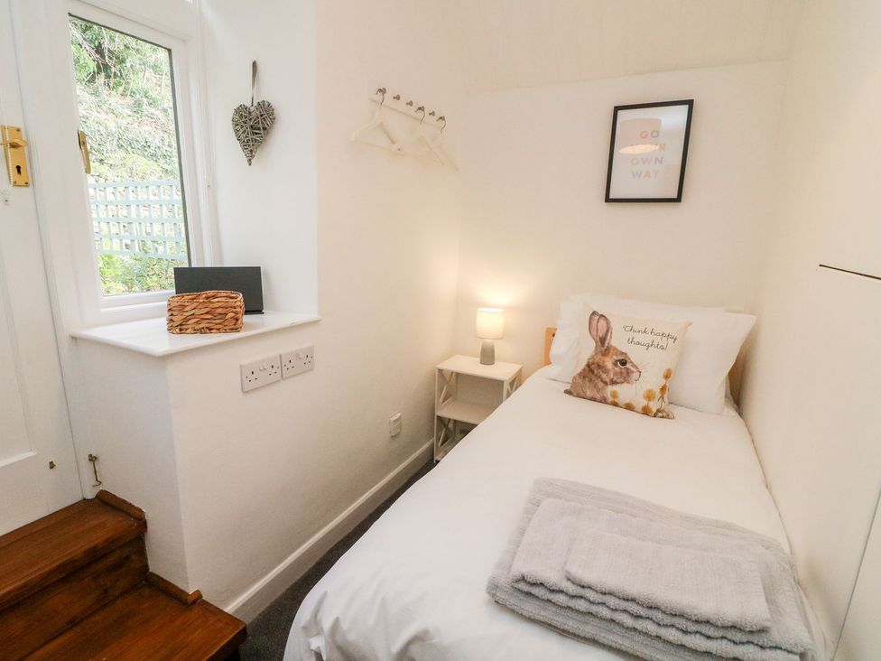 A bedroom with a single bed and window at Crag Cottage Settle