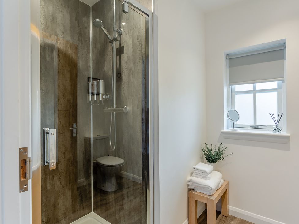 A bathroom with a shower and toilet at Broomfield Hideaway near Inverness
