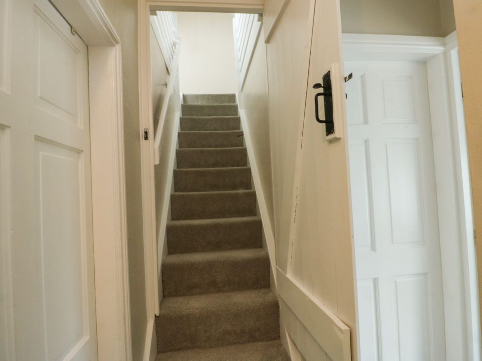 A staircase leading to an upper floor at Mor Awelon in Moelfre