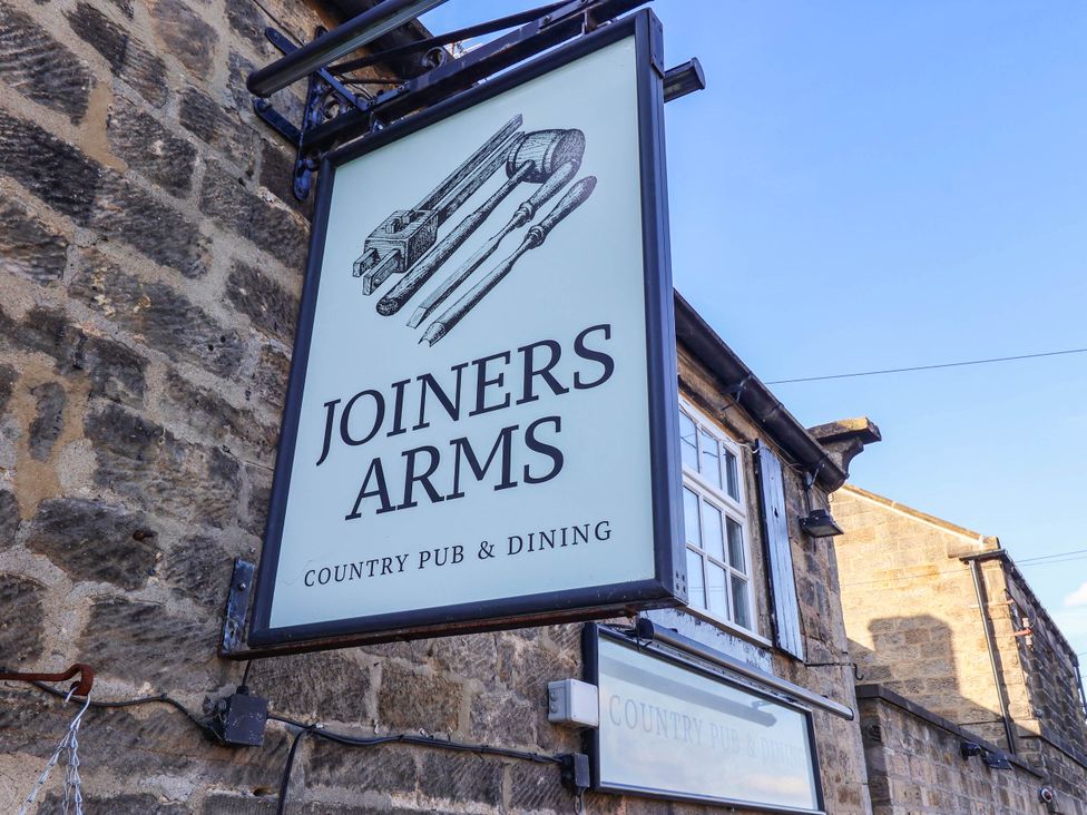 A sign for Joiners Arms country pub and dining at Winksey Cottage in Harrogate