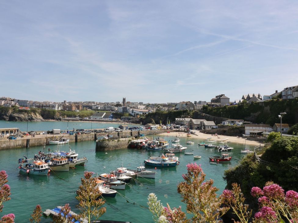 A view of a harbour with boats and buildings at 87 Atlantic Reach Newquay