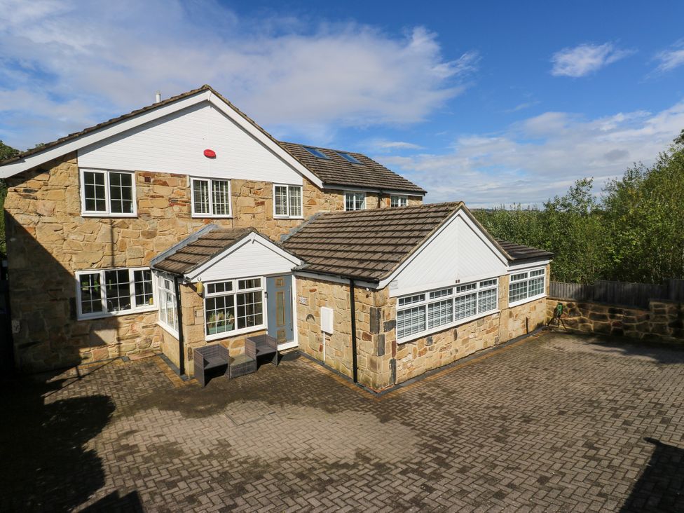 A house exterior with brick walls and windows at Nabwood views
