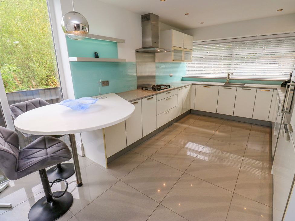 A kitchen with a table and chairs at Nabwood views 