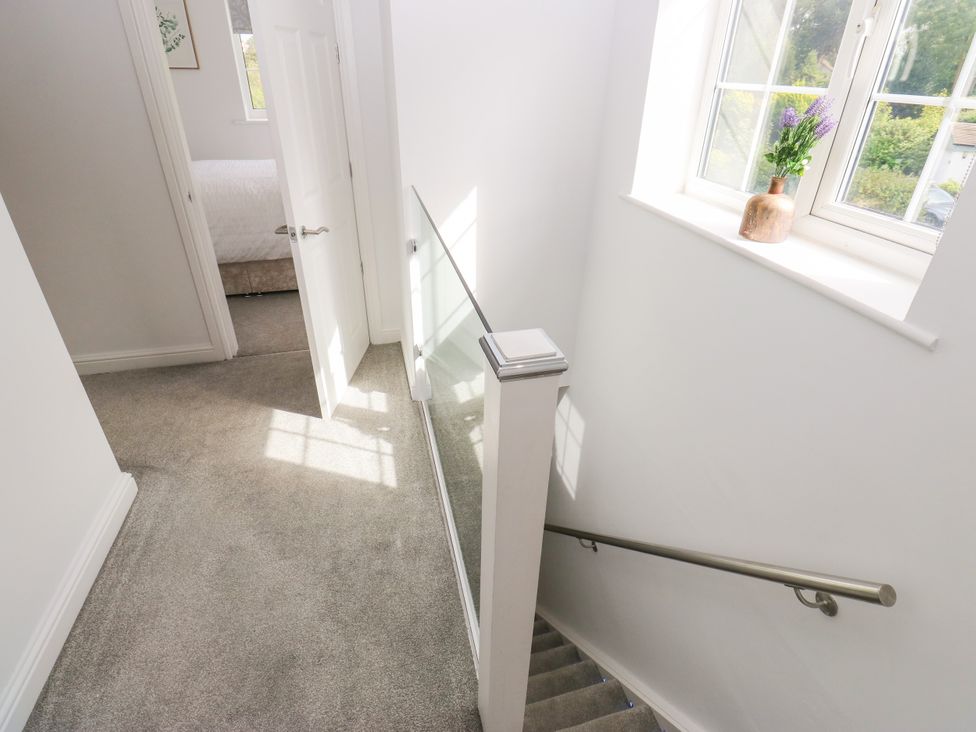 A stairway with a window and door at Nabwood views 