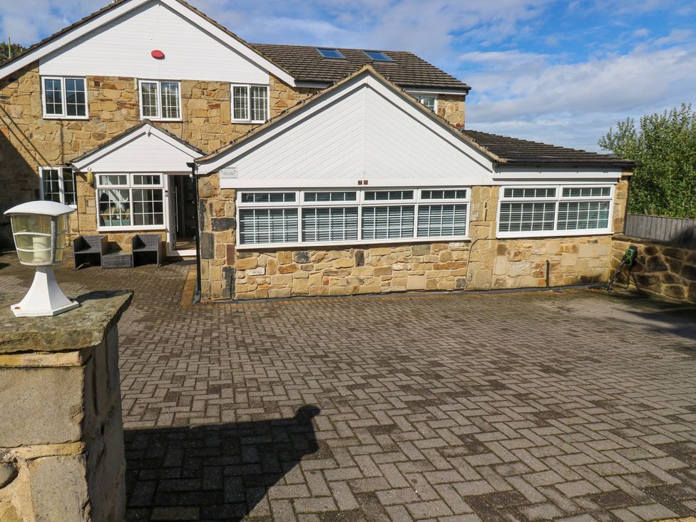 A house exterior with windows and a paved area at Nabwood views