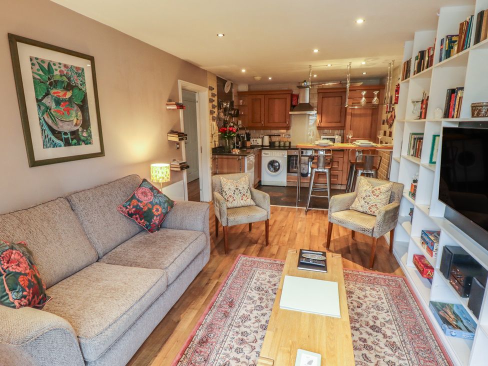 A living room with a sofa and table at Apartment 173 Lincoln
