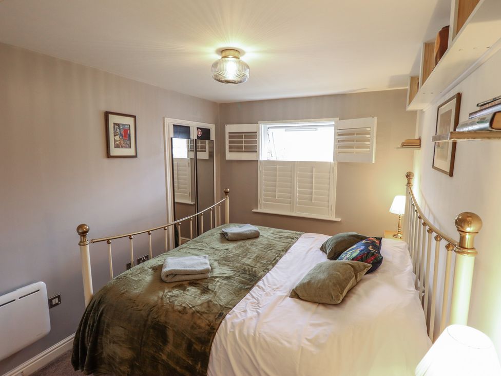 A bedroom with a bed and a window at Apartment 173 in Lincoln