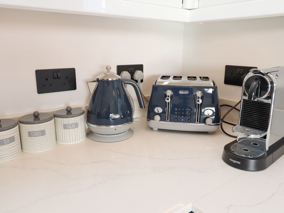 A kitchen counter with kettle toaster and coffee machine at Holm, Strond near Carminish, Isle Of Harris
