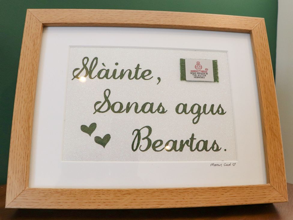 A framed text artwork at Holm in Strond near Carminish, Isle Of Harris