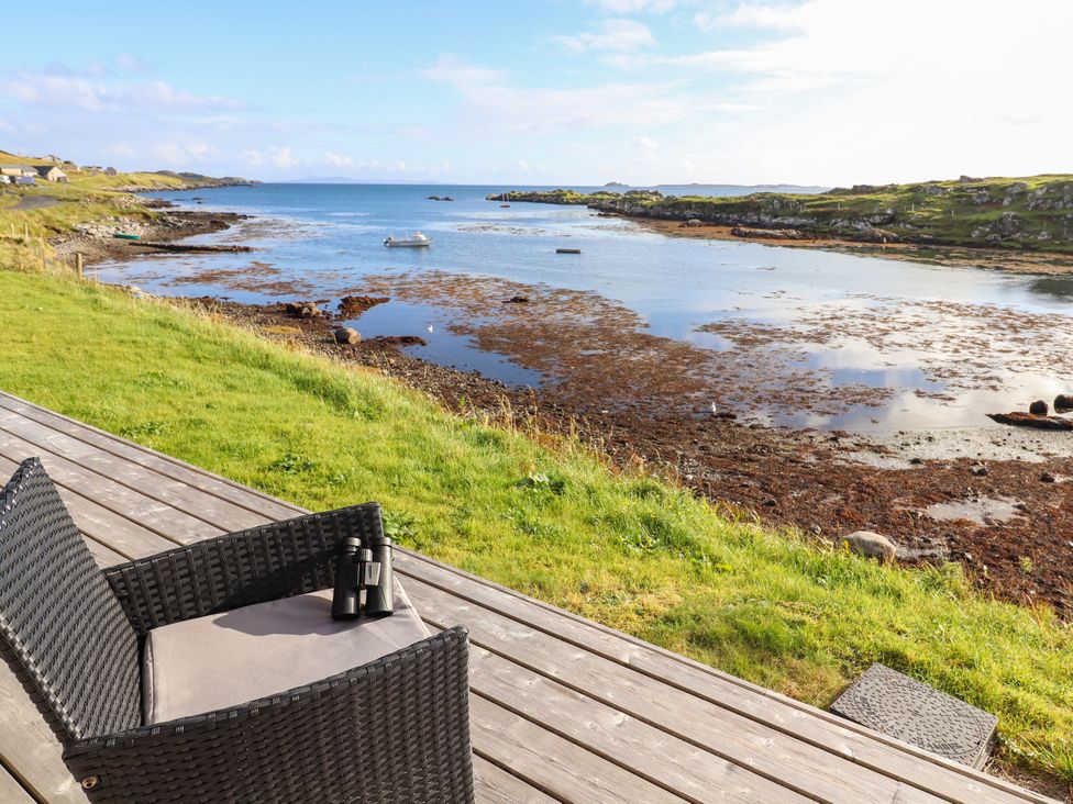 A view of the water from a seating area at Holm in Strond near Carminish, Isle Of Harris