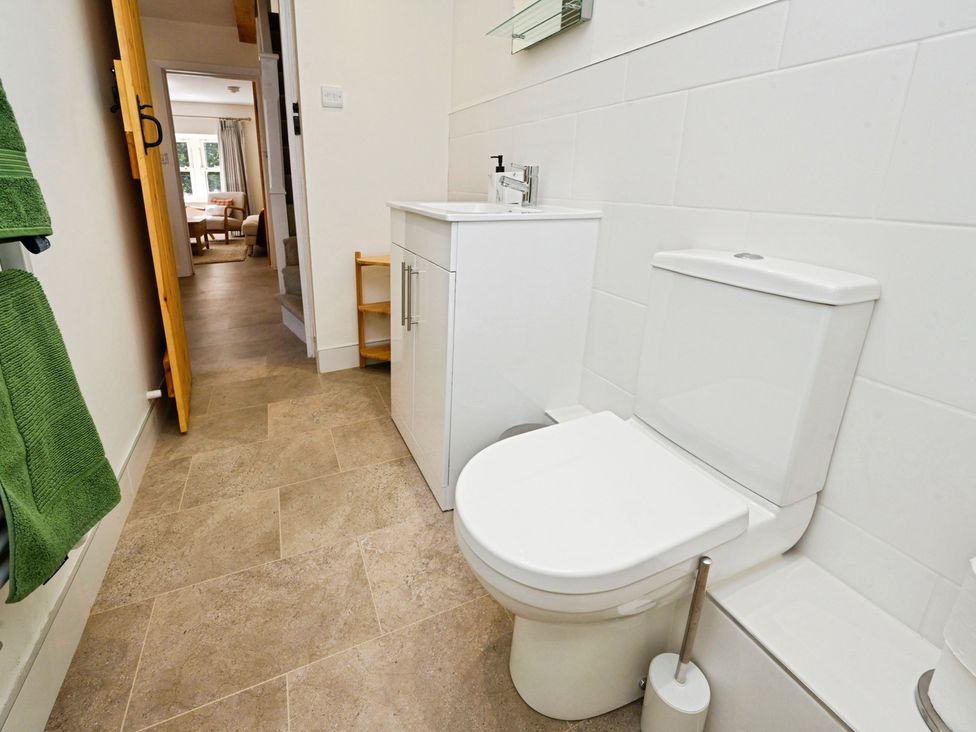 A bathroom with a sink and toilet at Susans Cottage in 