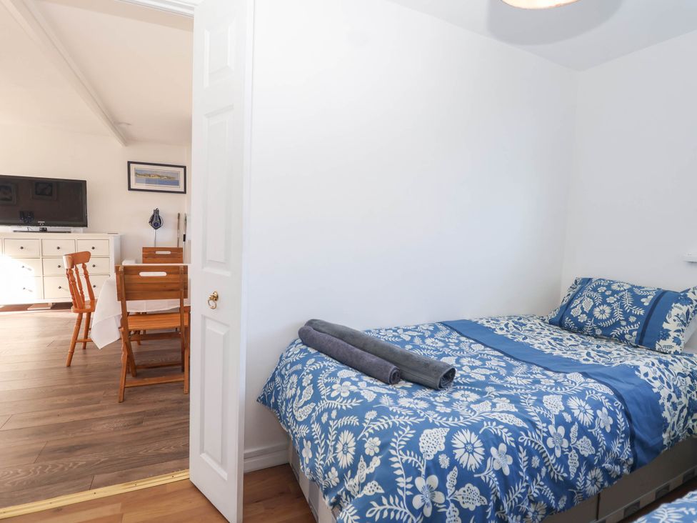 A bedroom with a bed and a TV at 122 Norton Park Dartmouth