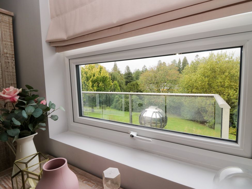 A window with a view of greenery at 10 Rayrigg Rise in Bowness-On-Windermere