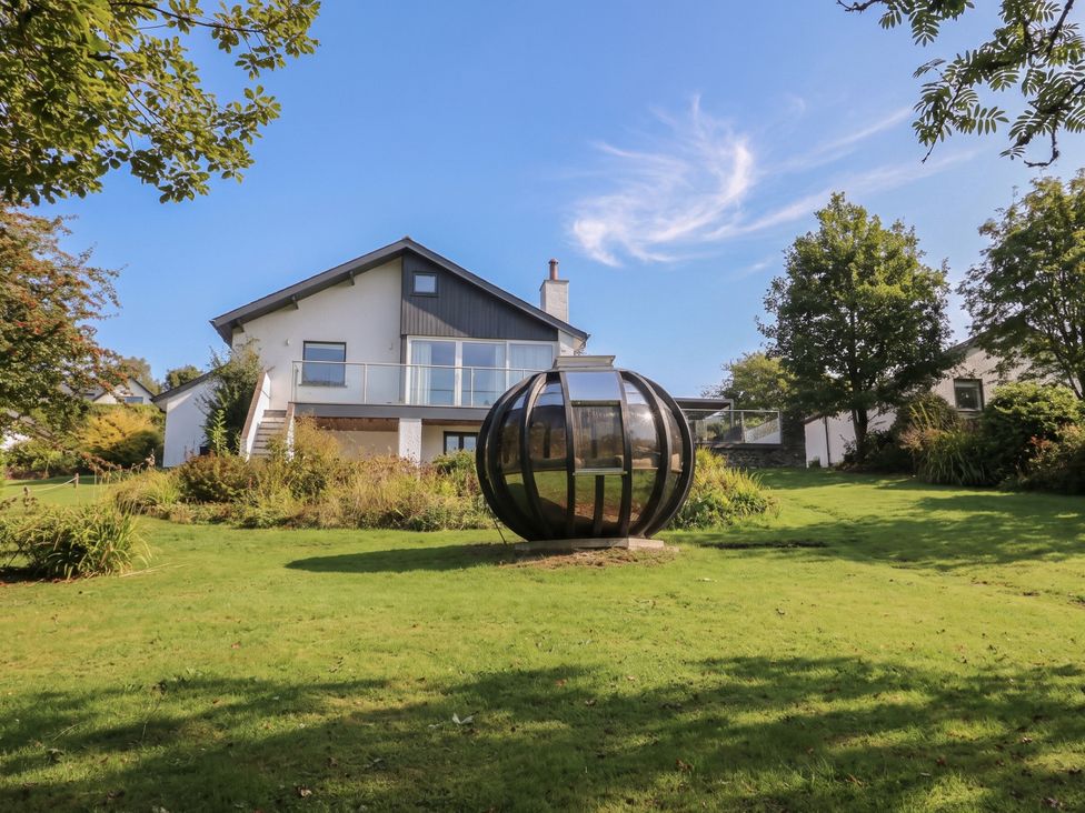 A house with a garden and a glass structure at 10 Rayrigg Rise Bowness-On-Windermere