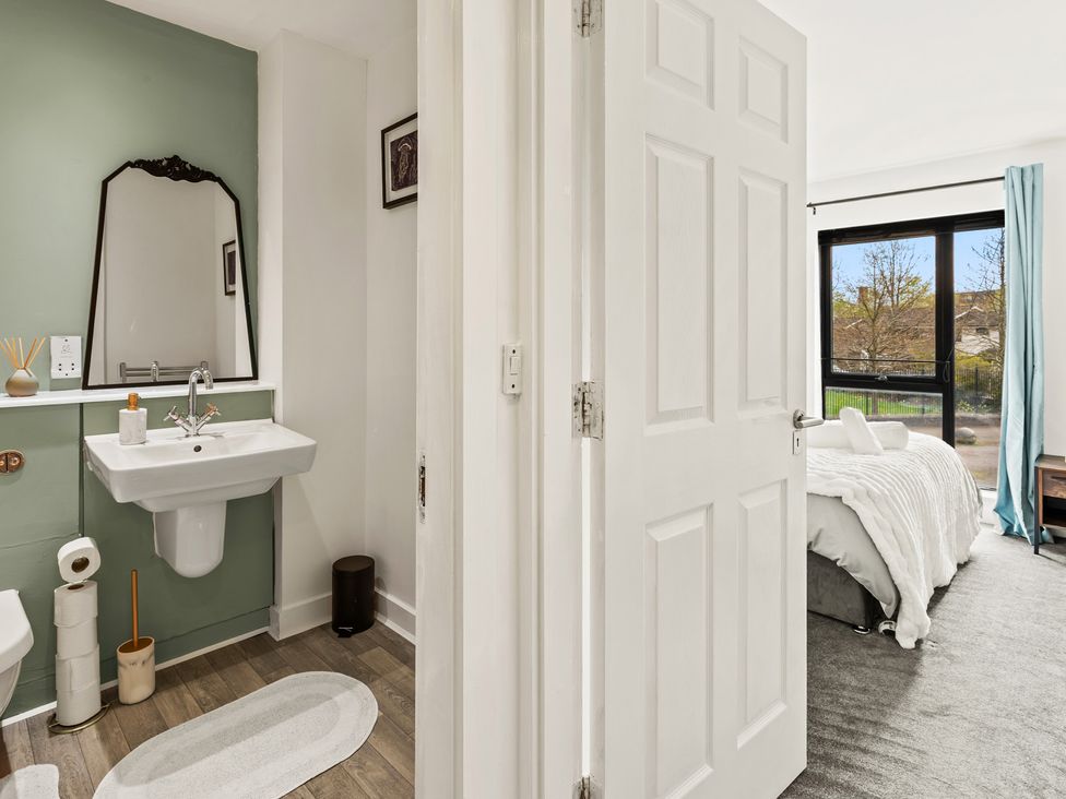 A bathroom with a sink and toilet at 11 Radclyffe Mews in Salford