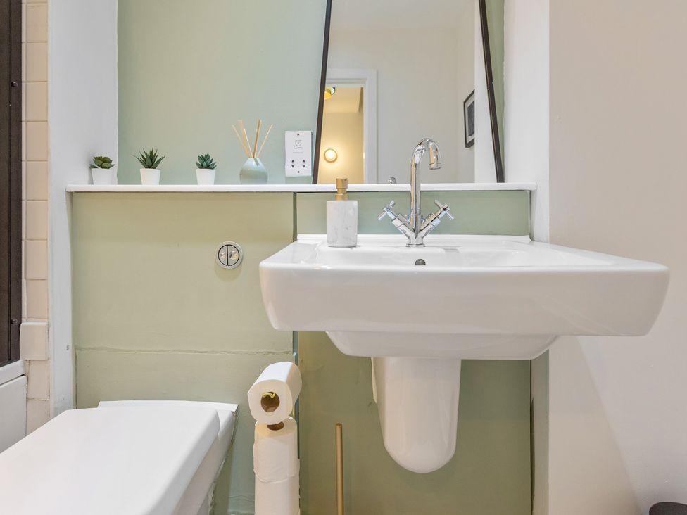 A bathroom with a sink and toilet at 11 Radclyffe Mews Salford