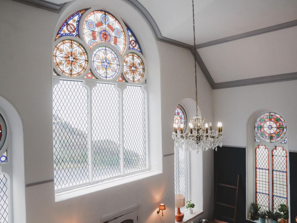 Stained glass windows and chandelier at Chapel of Arts in Criccieth