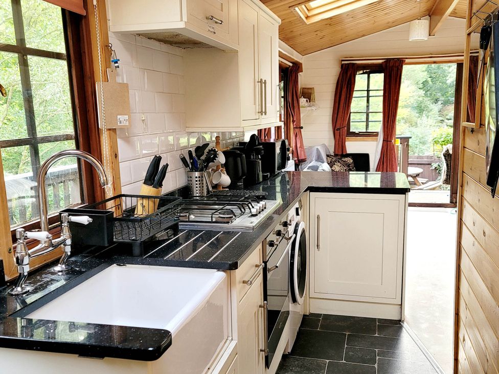 A kitchen with a sink and stove at River Lodge in Lynbridge near Lynmouth