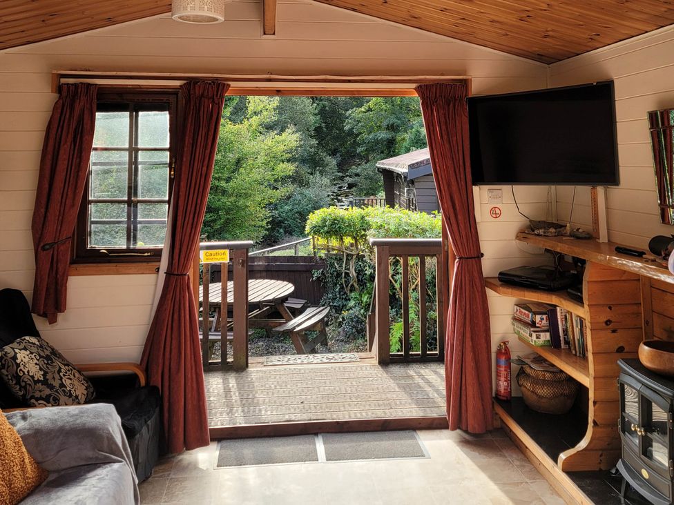 A snug with a view of outdoor seating at River Lodge in Lynbridge near Lynmouth
