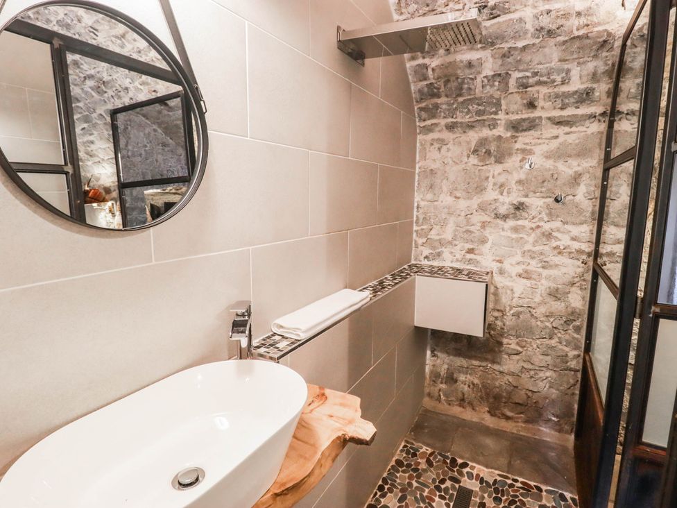 A bathroom with a sink and shower at The Bakery Hotel Room in Gileston near St Athan